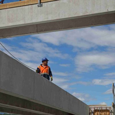 Builders,Construct,A,Concrete,Bridge,Over,A,Small,River,In